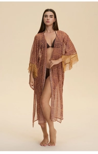 Detail of bohemian chiffon cover-up showing vintage geometric prints and yellow fringe