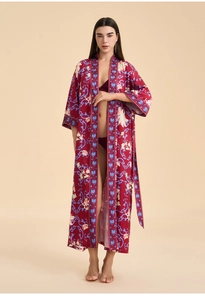 Detail of long floral kimono robe with wide sleeves and patterned waist belt