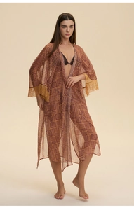 Detail of vintage geometric print chiffon robe featuring elegant gold tassel cuffs