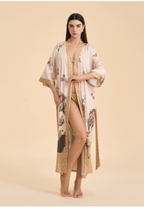 Close-up of floral print long kimono robe with elegant gold geometric trim and tie belt