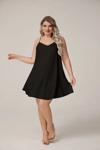 Detailed view of the A-line hemline on this plus size black satin slip dress for women