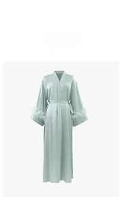 Close-up of mint green satin robe featuring luxurious detachable feather cuffs and V-neck