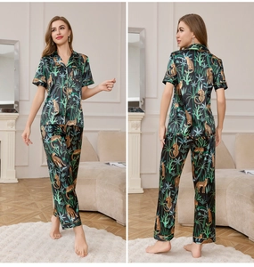 Detail view of ice silk pajamas featuring tropical leopard print and classic button-down style