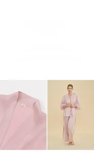 Detail of pink satin pajama set with detachable feather cuffs and elegant V-neckline