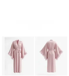 Front and back view of elegant pink satin bridal robe with luxurious feather trim cuffs