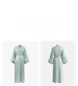 Detail view showing mint green satin robe with luxurious feather trim on the sleeves