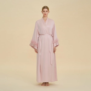 Elegant long light pink silk robe with ostrich feather trim on sleeves and waist tie