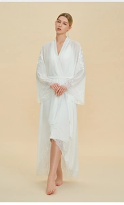 Detailed lace stitching on white chiffon bridal robe sleeves and elegant scalloped hem
