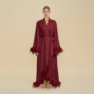 Luxurious long satin robe in wine red with elegant feather trim and a waist tie closure