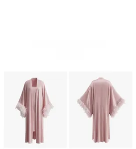 Detail of pink silk sleepwear featuring elegant feather cuffs and luxurious texture