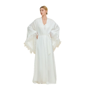 Elegant white satin bridal robe with luxurious feather cuffs and tie-waist closure