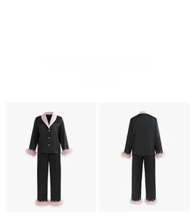 Détail d'un pyjama en satin noir avec col rose contrasté et finitions en plumes