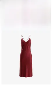 Detail of the deep red satin nightdress showing thin straps and smooth silk-like texture