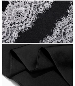 Detailed close-up of delicate white floral lace and premium black chiffon stitching
