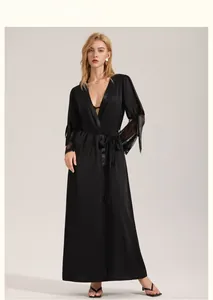 Detail of elegant black long satin robe featuring intricate lace trim on the sleeves