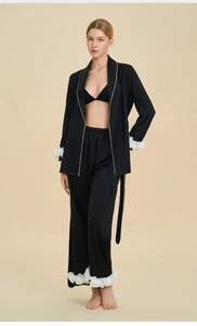 Elegant black satin three-piece pajama set with white 3D flower accents on cuffs