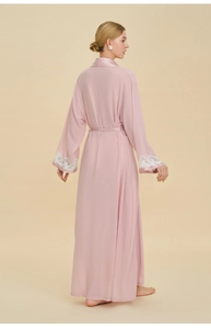 Rear view of long pink satin robe featuring elegant white lace trim on the sleeves