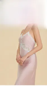 Detail of pink satin nightgown featuring white floral lace patchwork on chest and side