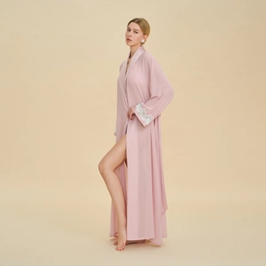 Pale pink long sleeve dressing gown with white lace cuffs and high side slits
