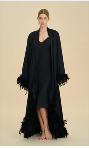 Luxurious black long robe featuring dense feather trim on cuffs and hem with silk finish