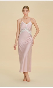 Close-up of pink satin nightgown featuring white lace V-neck and hollow waist detail