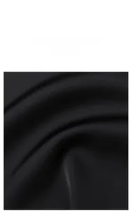 Detail of luxurious black silk fabric with smooth texture and elegant fluid draping