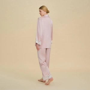 Elegant pink satin pajama set for women featuring long sleeves and lace trim detailing