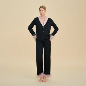 Luxury black satin pajama set with pink faux feather trim on sleeves and pant cuffs