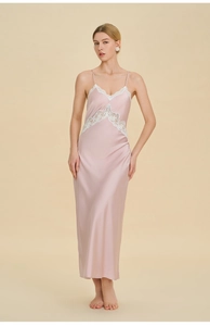 Detail of pink satin nightgown featuring white lace trim and elegant spaghetti straps