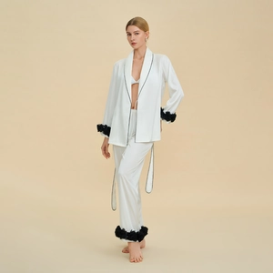Elegant white satin pajama set with black 3D floral accents and contrast piping trim