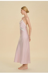Close-up of pink satin nightgown featuring elegant white lace trim and V-neckline detail