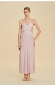 Close-up of pink satin nightgown with elegant white lace trim and V-neckline detail