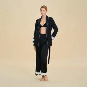 Elegant black three-piece women's pajama set with white frill trim and satin finish