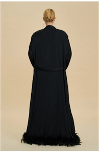 Detailed back view of luxury black long robe featuring ostrich feather trim and tie waist