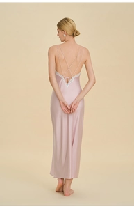 Detailed back view of a satin nightgown featuring lace trim and criss-cross straps