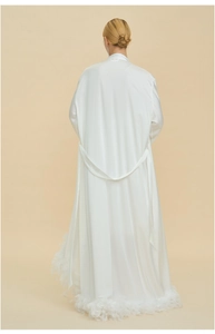 Rear view of luxury white satin robe featuring elegant feather trim and silk texture