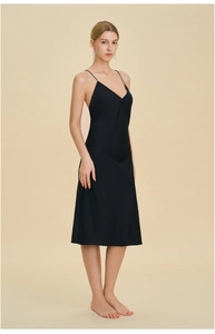 Detail of the black silk satin camisole nightgown featuring thin straps and a V-neckline
