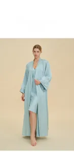 Detailed view of light blue satin pajama set featuring feather cuffs and silky robe for women