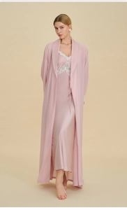 Close-up of silk-like pink robe and lace trim slip dress with elegant drape and texture