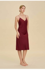 Detail of burgundy V-neck satin nightgown featuring slim straps and silky smooth texture