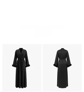 Detail of luxury black satin robe featuring elegant feather trim cuffs and waist tie