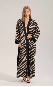Detail view of full-length zebra print chiffon robe with loose long sleeves and black trim