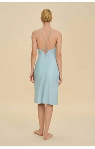 Close-up of the cross back lacing on a light blue satin nightgown for women