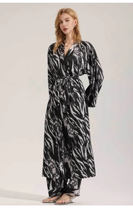 Detail of black and white tiger print satin robe set with wide leg pants and waist belt