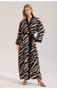 Detail of zebra print chiffon robe with elegant lace sleeves and black waist tie