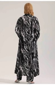 Back view of a long satin zebra print robe featuring a belted waist and matching trousers