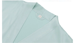 Detail of mint green satin robe collar with One Size label and interior hanging loop