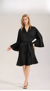 Elegant matte satin bathrobe with bell sleeves and ruffled hem on a model display