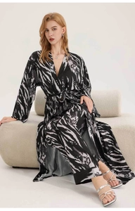 Detail showing luxurious leopard print satin fabric and tailoring of the home loungewear set