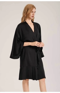 Detail of elegant black satin robe featuring a deep V-neck, flared sleeves and ruffled hem